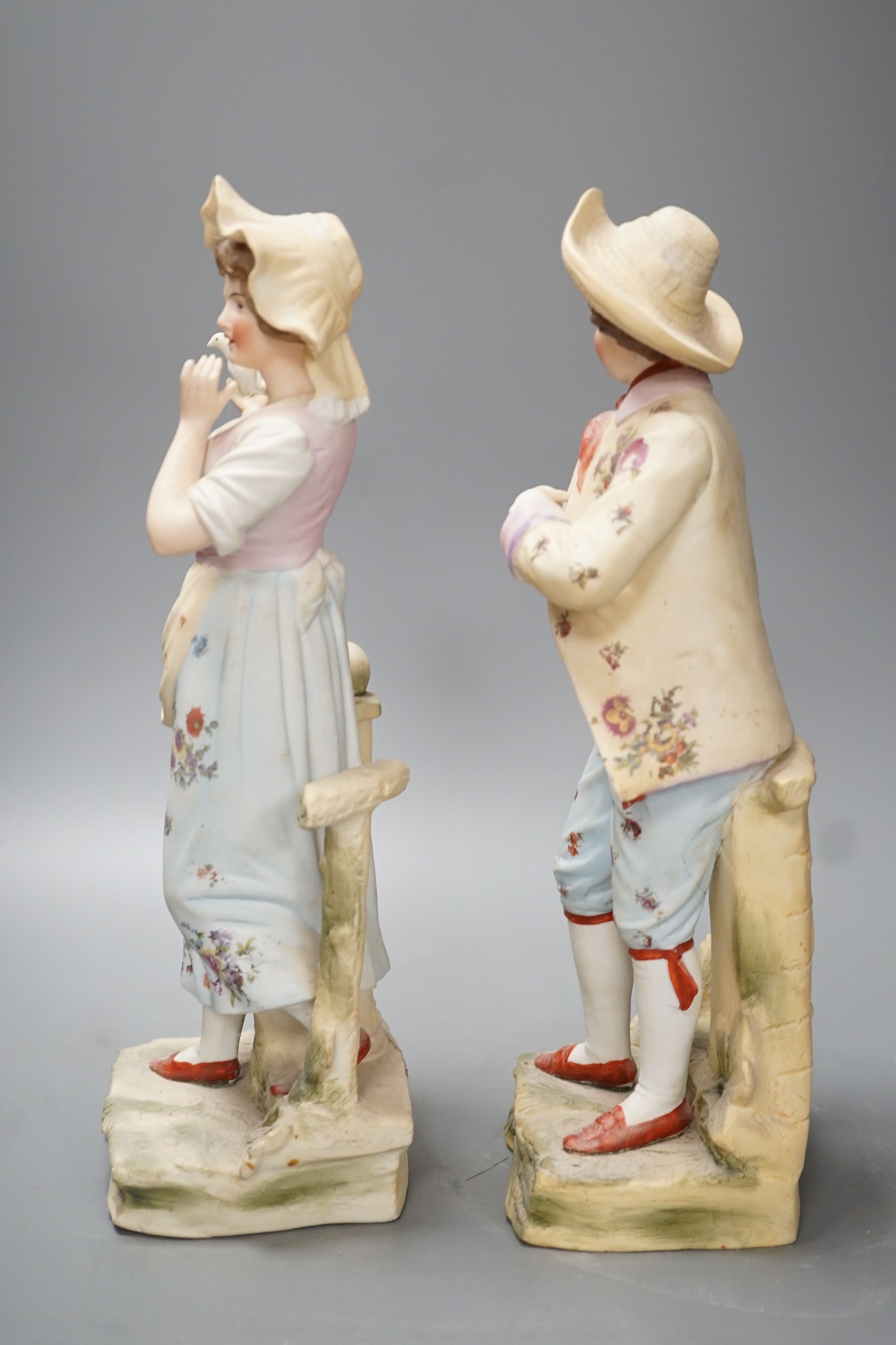 A pair of bisque figures - 34.5cm